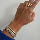 Waterproof Gold and silver bezel CZ tennis bracelets stacked six deep on wrist – Nikki E. Designs