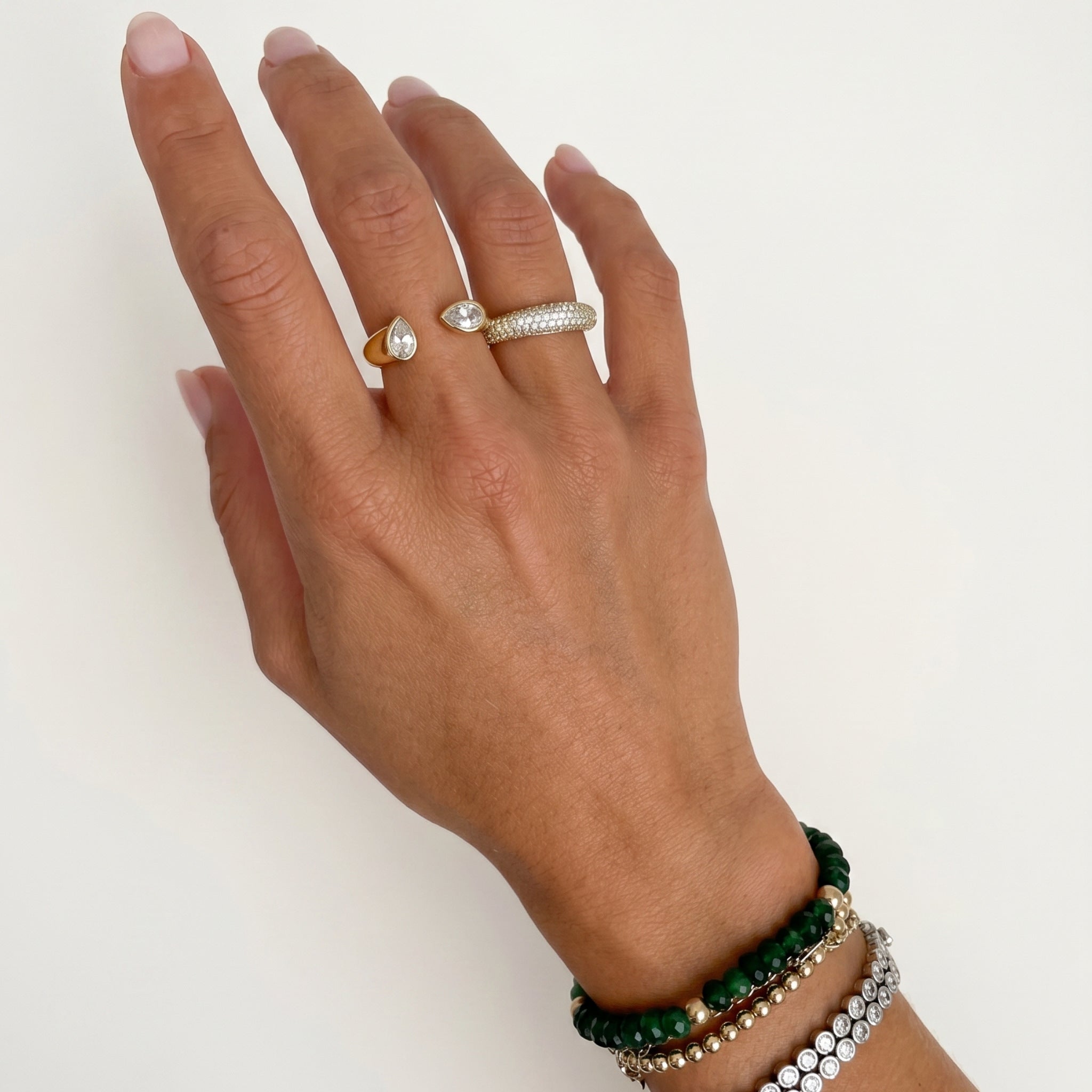 Waterproof Gold and silver adjustable pear CZ open cuff cocktail rings stacked on fingers – Nikki E. Designs