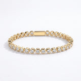 Waterproof Mini Remi bezel-set CZ tennis bracelet in gold surgical stainless steel on white background – Nikki E. Designs