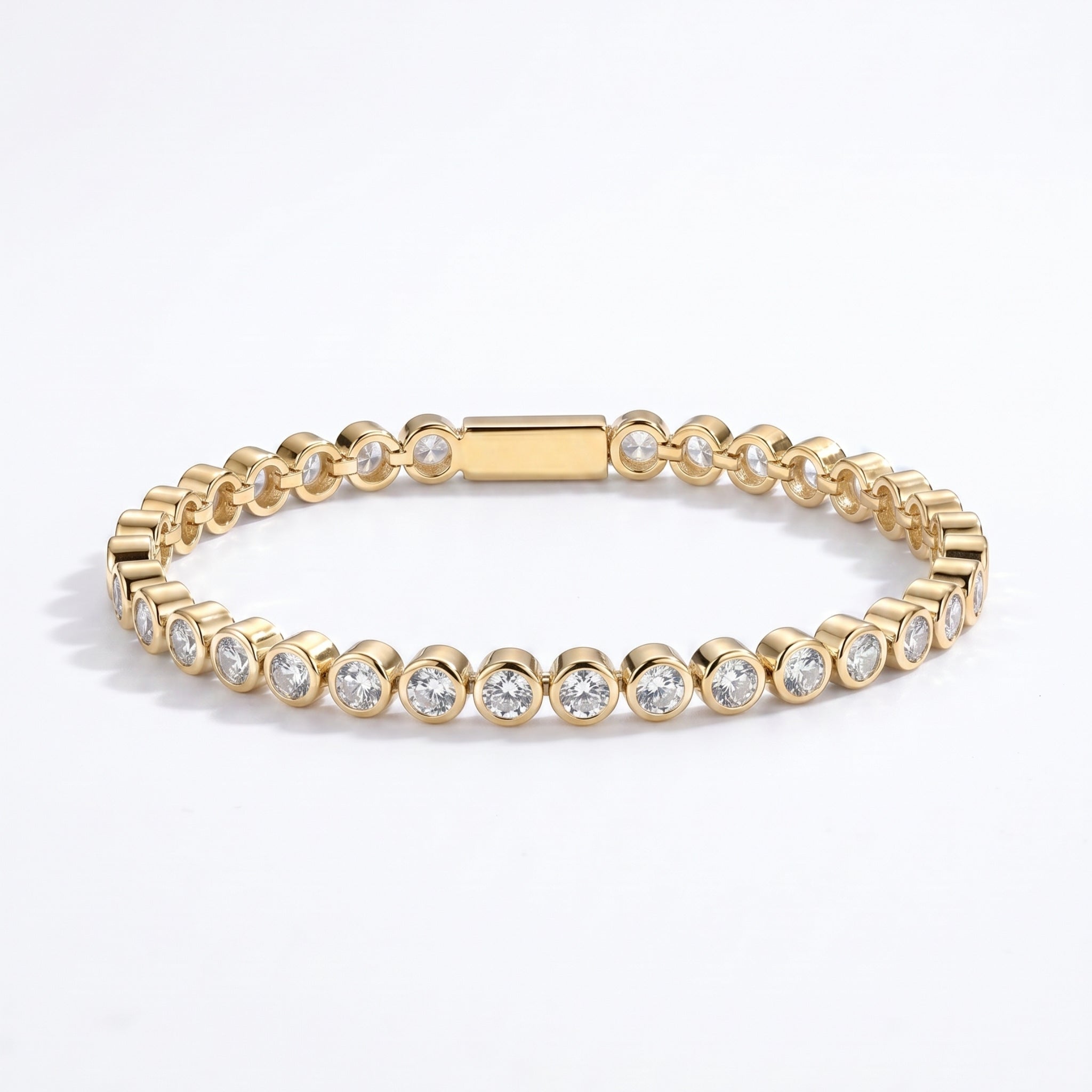 Waterproof Mini Remi bezel-set CZ tennis bracelet in gold surgical stainless steel on white background – Nikki E. Designs