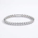 Waterproof Mini Remi bezel-set CZ tennis bracelet in silver surgical stainless steel on white background – Nikki E. Designs