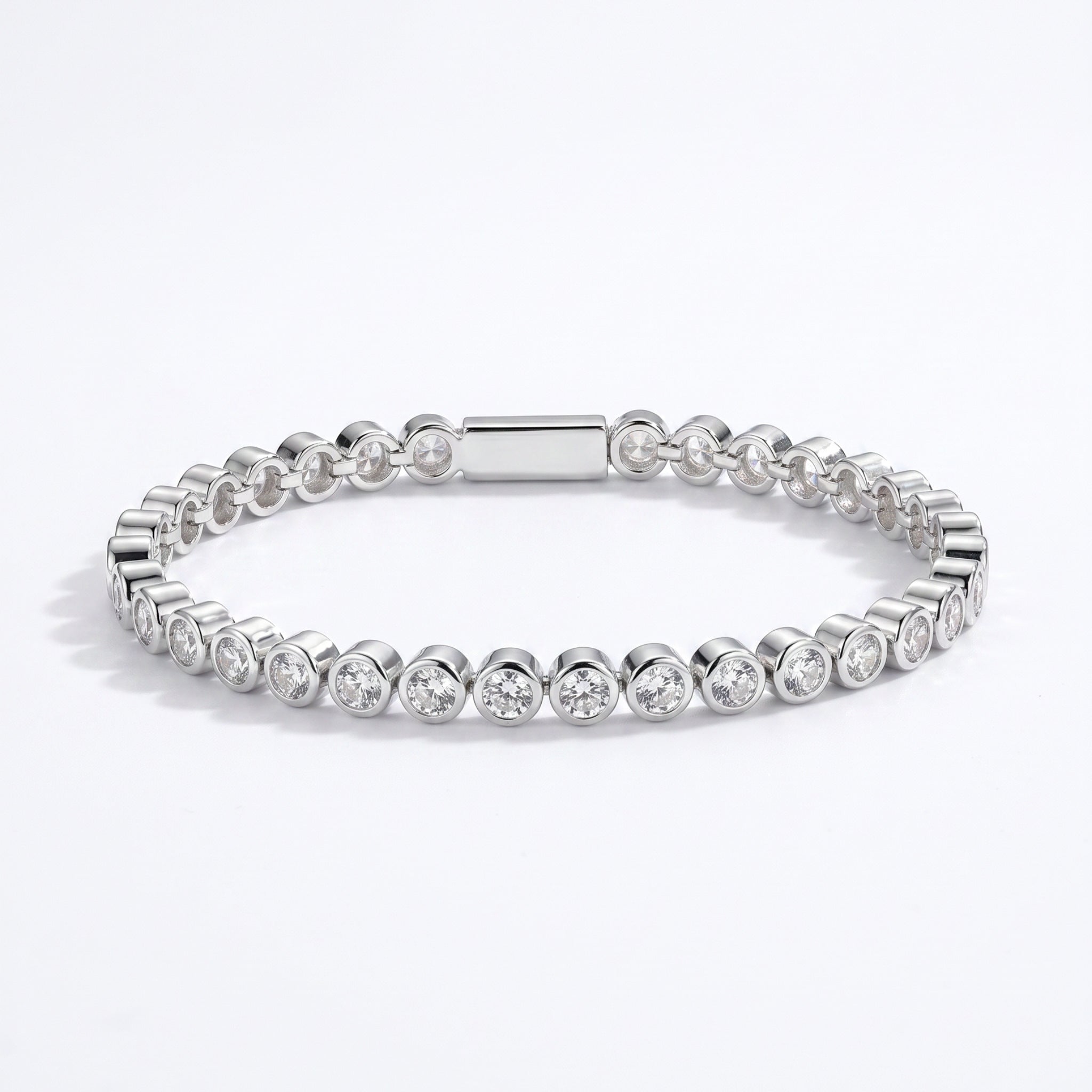 Waterproof Mini Remi bezel-set CZ tennis bracelet in silver surgical stainless steel on white background – Nikki E. Designs