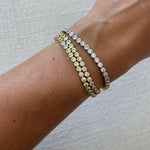 Waterproof Gold and silver bezel CZ tennis bracelets stacked six deep on wrist – Nikki E. Designs