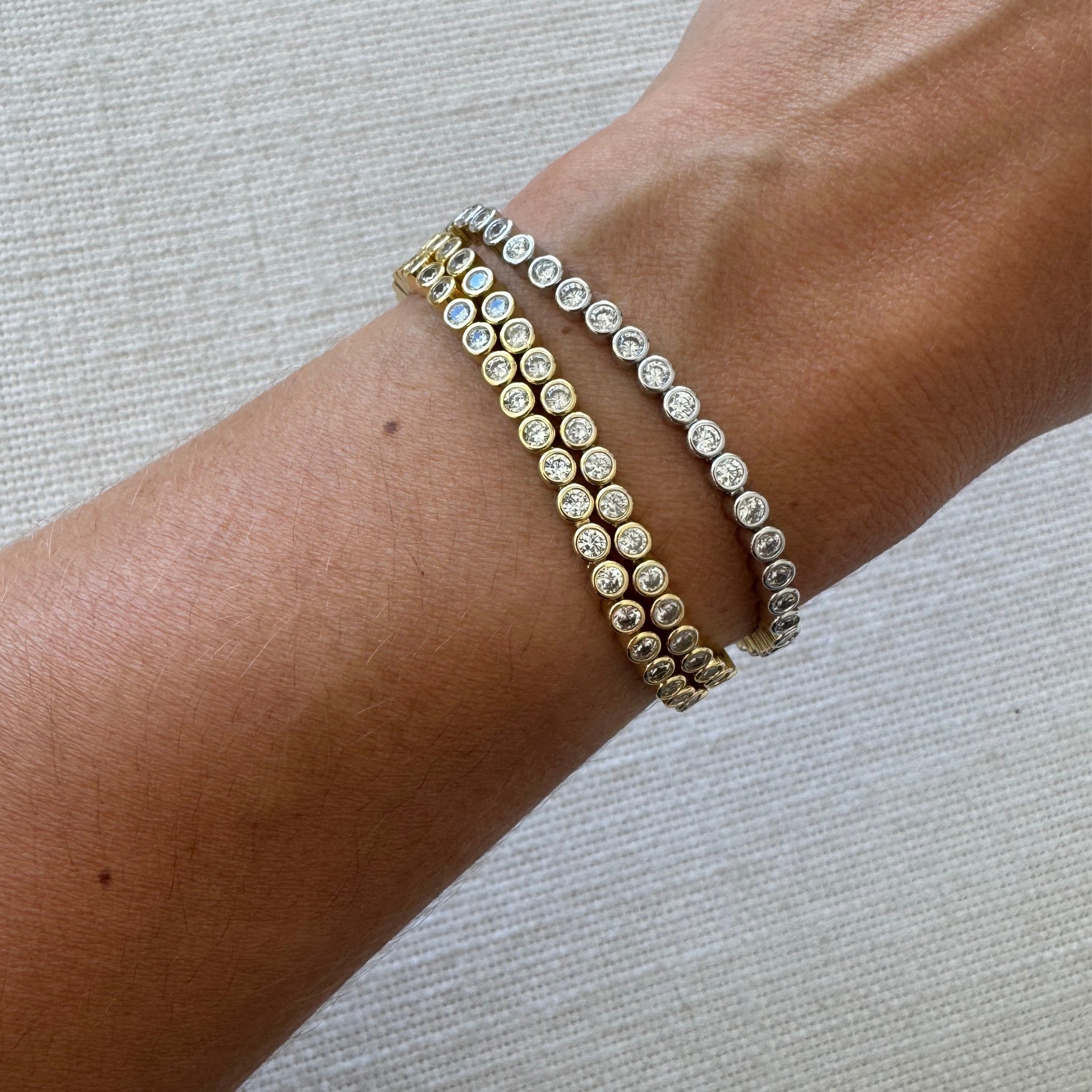 Waterproof Gold and silver bezel CZ tennis bracelets stacked six deep on wrist – Nikki E. Designs
