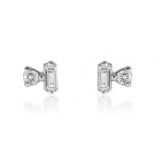 Pair of diamond earrings on a white background. Nikki E Designs Ada Studs Silver Earrings