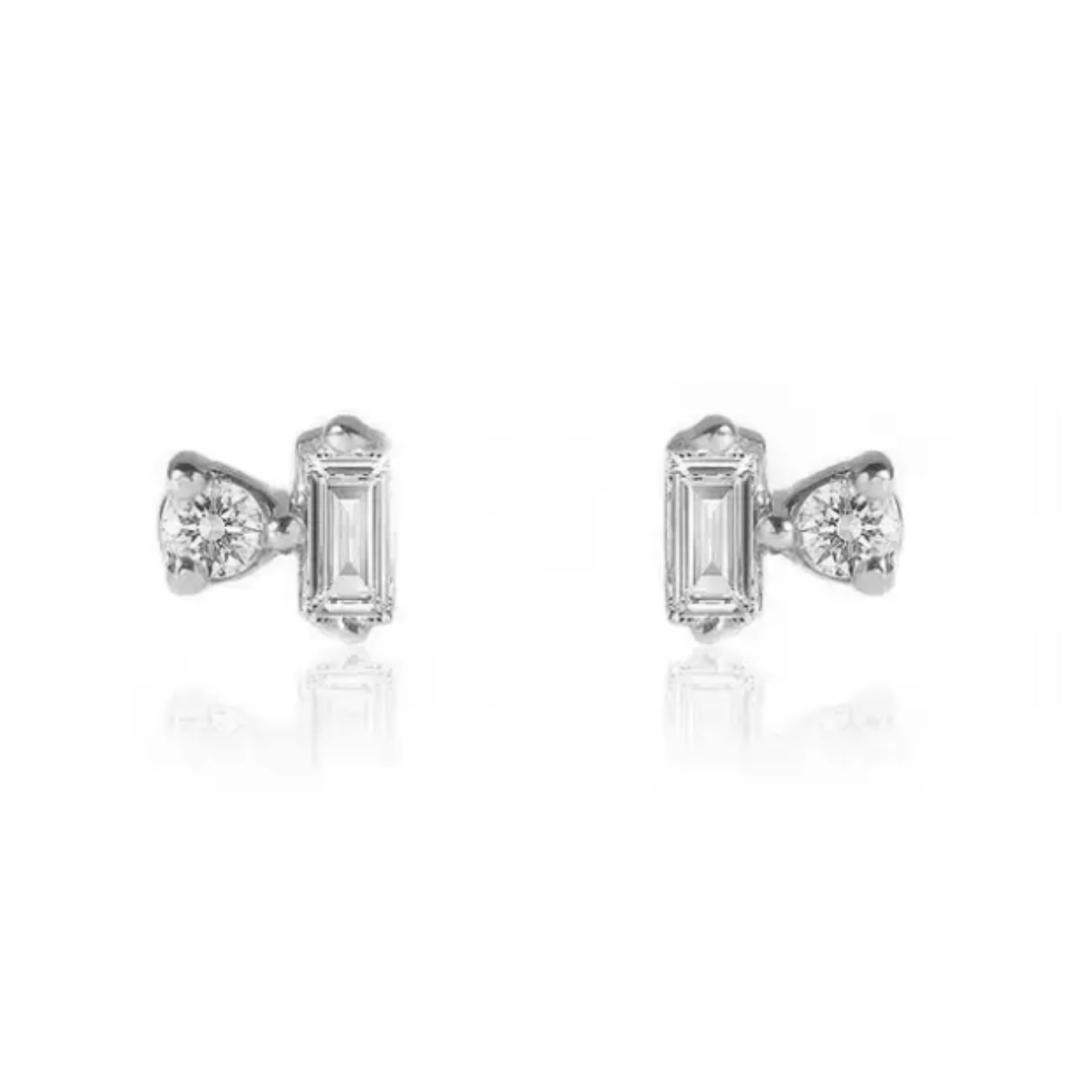 Pair of diamond earrings on a white background. Nikki E Designs Ada Studs Silver Earrings