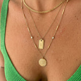 Gold coin necklace layered with cuban curb chain and tag pendant with green top – Nikki E. Designs