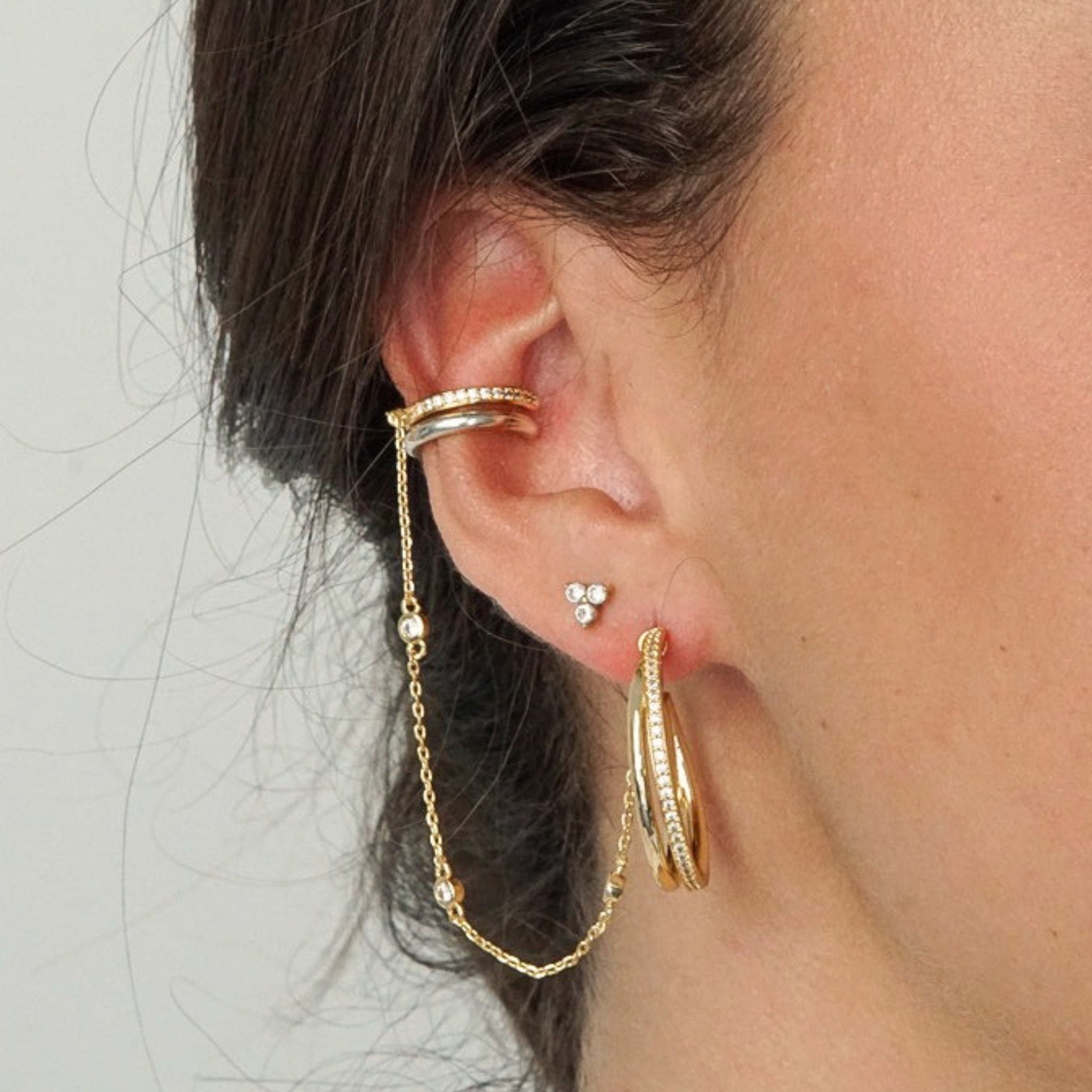 Gold triple cluster CZ stud earrings worn as second piercing in ear stack – Nikki E. Designs