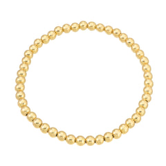 Vida 4mm gold bead stretch bracelet in surgical stainless steel on white background – Nikki E. Designs