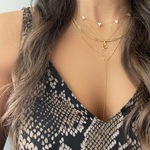 Gold lariat necklace layered with station cluster stone necklace and pendant necklace – Nikki E. Designs